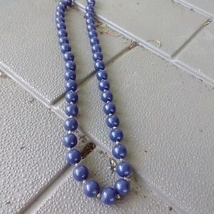 Women's blue plastic beaded necklace.